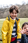 Brothers playing in countryside