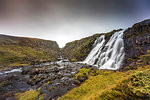 Waterfall cascading into river, Eyja- og Miklaholtshreppur, Vesturland, Iceland