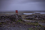 Lone red chair placed in middle of nowhere, Ring Road, Iceland