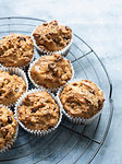 Freshly baked chocolate chips muffins on cooling tray