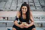 Young woman using smartphone on stairways