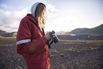 Hiker looking at camera, Landmannalaugar, Highlands, Iceland