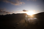 Off road vehicle in desert at sunset, Landmannalaugar, Highlands, Iceland