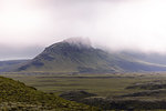 Fog covering peak of mountain range, Landmannalaugar, Iceland