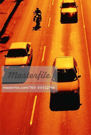 Traffic on Highway at Sunset