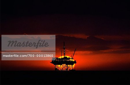 Silhouette of Offshore Oil Rig at Sunset, Carpinteria, California, USA