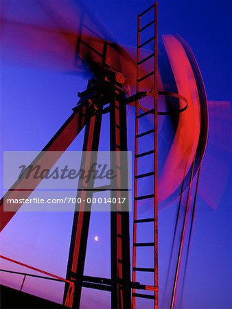 Oilfield Pumpjack in Motion at Sunset Near Drayton, Alberta, Canada