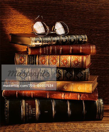 Stack of Antique Books and Eyeglasses