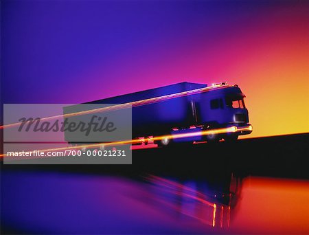 Transport Truck with Light Trails At Sunset