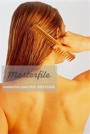 Back View of Woman Combing Hair