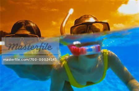 Couple plongée Iles Maldives, océan Indien