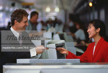 Businessman Purchasing Airline Ticket