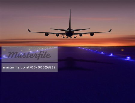 Rear View of Airplane Taking Off From Runway at Sunset