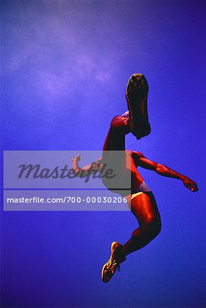 Looking Up at Man Long Jumping