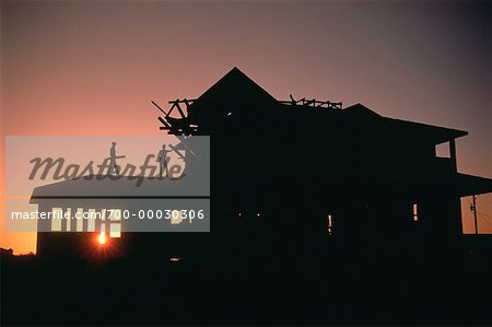 Silhouette of House Construction At Sunset