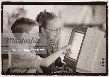 Boy and Girl Using Computer