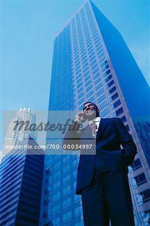 Businessman Using Cell Phone Outdoors