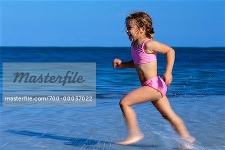 Girl in Swimwear, Running on Beach