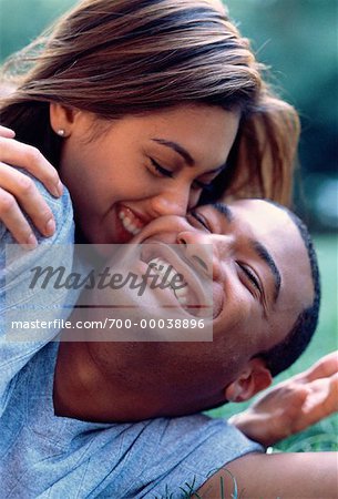 Couple Lying Outdoors, Laughing