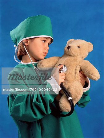 Child Dressed as Doctor with Teddy Bear