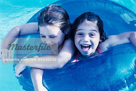 Girls with Inner Tube in Swimming Pool