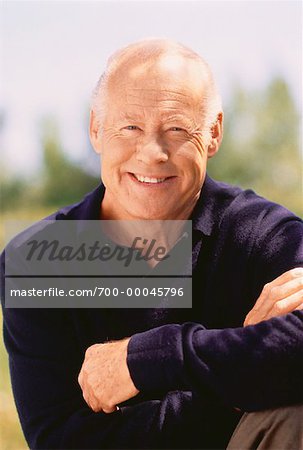 Portrait of Mature Man with Arms Crossed Outdoors