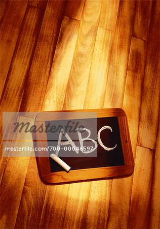 ABC on Blackboard on Wood Floor