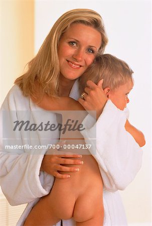 Portrait of Mother Wearing Bathrobe Holding Child