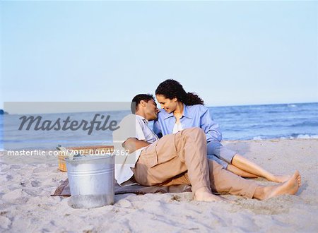 Couple Having Picnic on Beach