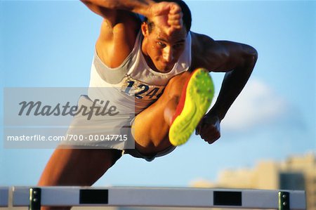 Man Jumping Hurdles