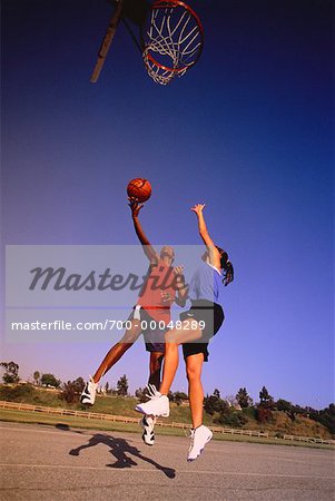 Women Playing Basketball Outdoors