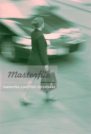 Blurred View of Businesswoman Walking on Street