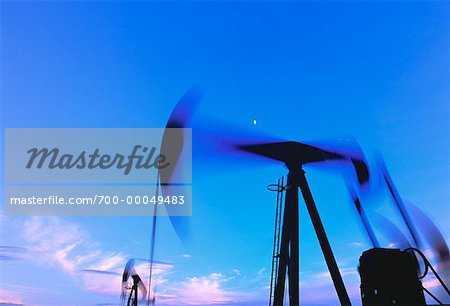 Oil Pump Jacks in Motion with Crescent Moon Alberta, Canada