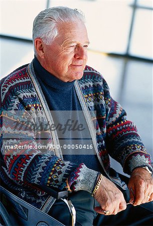 Mature Man Sitting in Wheelchair