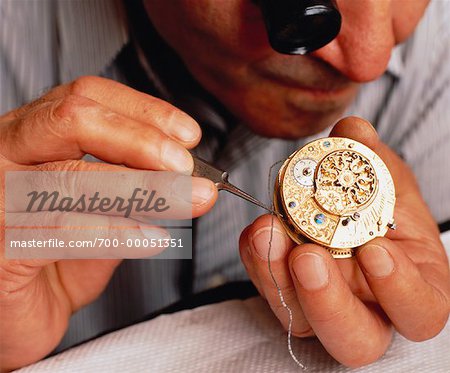 Close-Up of Watchmaker Repairing Clock
