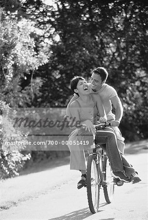 Couple Riding Bicycle on Path