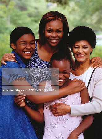 Portrait of Grandmother, Mother And Daughters in Park
