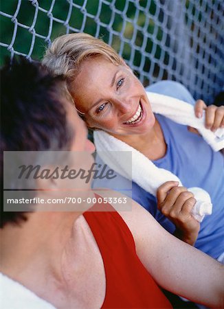 Mature Couple Resting in Park After Workout