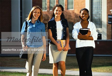 Portrait of Three Teenage Girls Standing Outdoors