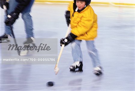 Father and Son Playing Hockey