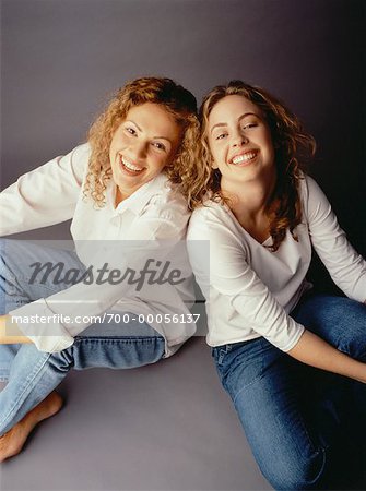Portrait of Two Women Sitting on Floor