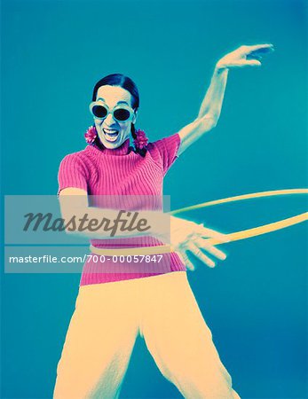 Mature Woman Wearing Sunglasses Using Hula Hoop