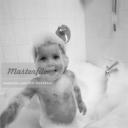Child in Bathtub, Covered in Bubbles