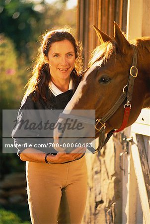 Portrait of Woman with Horse at Stable