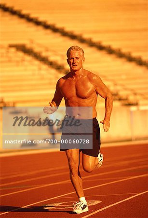 Mature Man Running on Track