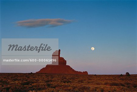 Overview of Rock Formation and Full Moon, Monument Valley, Arizona, USA