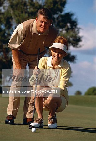 Mature Couple Golfing