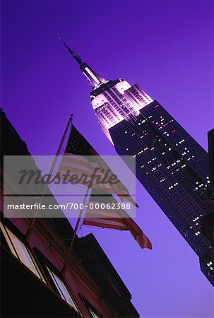 American Flag and Empire State Building at Night, NY, NY, USA