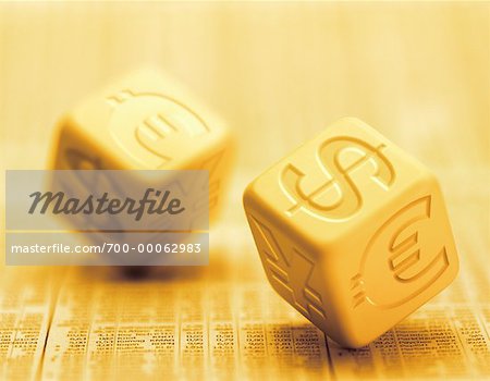 Close-Up of Dice with International Currency Symbols on Financial Page