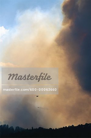 Smoke from Forest Fire with Fire Fighting Helicopter